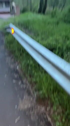 Roadside vegetation filmed along guardrail in Zlatograd, Bulgaria