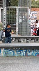 Skateboarders practice tricks at Barcelona skate park