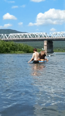 Summer day on the Mana River: paddleboards, swimming, and sunshine