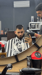 Man gets haircut at Bulgarian barbershop