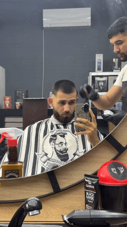 Man gets haircut at Bulgarian barbershop