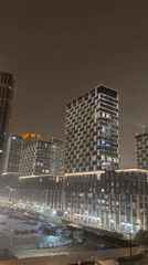 Nighttime illuminated high-rises captured in Khimki, Russia