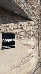 Visitors document art at Noguchi Museum during evening hours