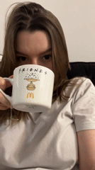 Woman enjoys quiet evening with mug and cat in Limassol