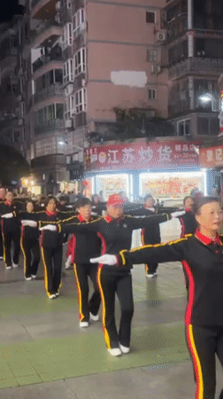 Evening group exercise routines observed across Jiangjin commercial district