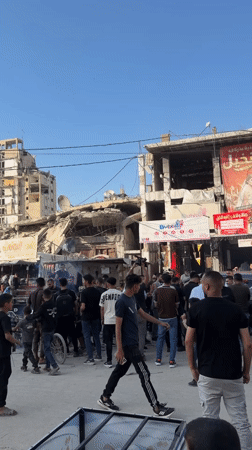 Crowds gather amid destruction in Gaza City