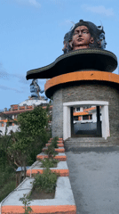 Tourist documents Pokhara's temples and cityscape from multiple angles