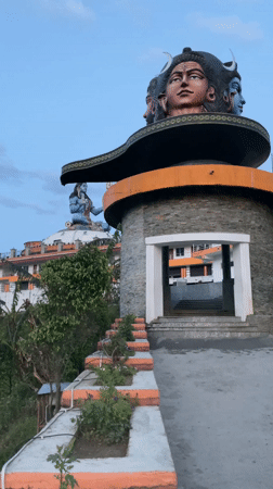 Tourist documents Pokhara's temples and cityscape from multiple angles