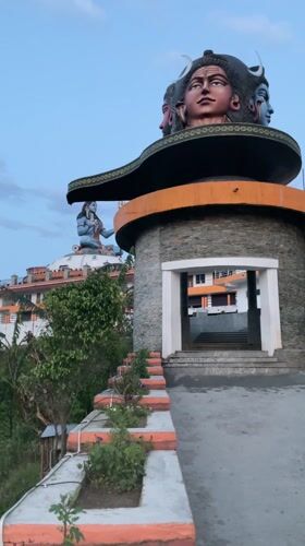 Tourist documents Pokhara's temples and cityscape from multiple angles
