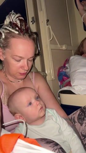 Quiet moment with a baby in a Russian train compartment
