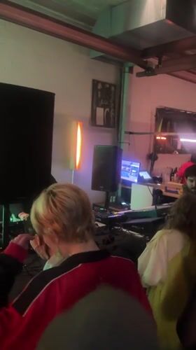 DJ performs for small crowd at evening event in The Hague