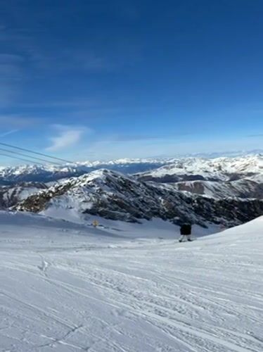 Skier enjoys sunny Alpine slopes in Austrian mountains