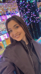 Woman photographed smiling at Moscow shopping mall
