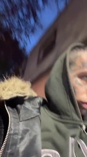 Tattooed man recorded on Buenos Aires street during evening