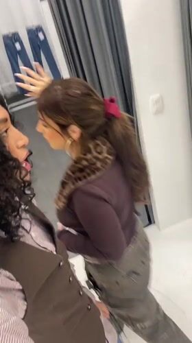 Woman observed in clothing studio conversation in Porto Alegre