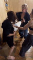 Group socializes, dances in wooden sauna during evening gathering