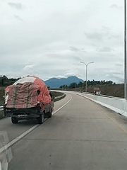 Loaded truck observed on Indonesian highway near Sihomlhok