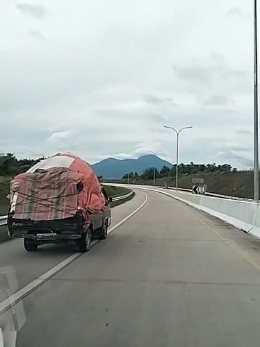 Loaded truck observed on Indonesian highway near Sihomlhok