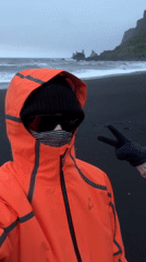 Tourist visits Iceland's famous black sand beach at Vik