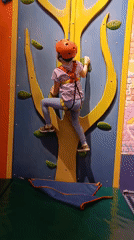 Families enjoy indoor recreation complex with climbing, dining activities
