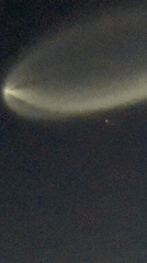 Bright contrail streaks across Los Angeles night sky