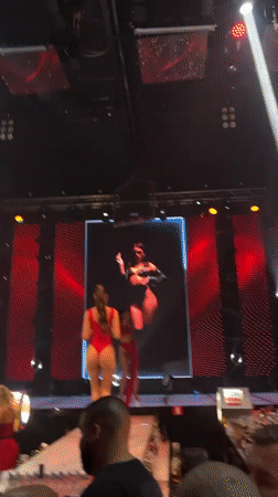 Live stage show with runway and red outfits in Plovdiv