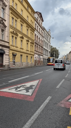Prague tram rolling through a historic city street