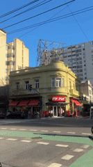 Buenos Aires street scene features yellow Pin Pun building