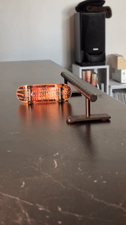 Person practices fingerboarding and drumming in Yekaterinburg apartment