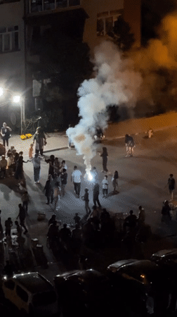 Nighttime street celebration in Konya with dancing and fireworks