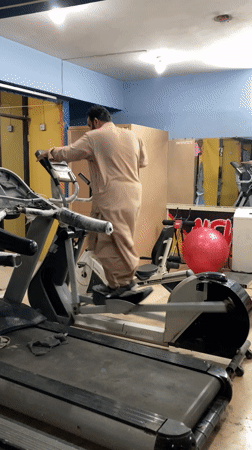 Man exercises in traditional clothing at Quetta gym
