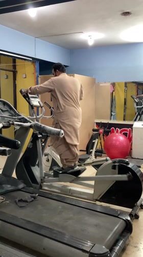Man exercises in traditional clothing at Quetta gym
