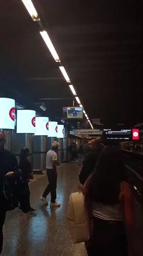 Commuters wait on subway platform in Providencia, Chile