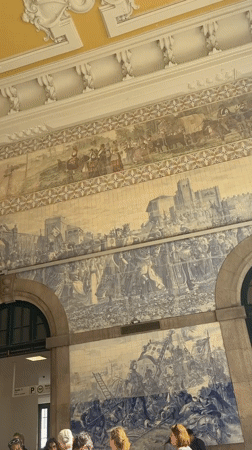 Blue and white azulejo murals line a grand historic interior in Gaia