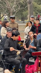 Elderly musicians perform traditional Chinese music in Beijing park