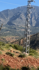 Rural electrical infrastructure documented in mountainous Morocco landscape