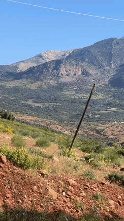 Rural electrical infrastructure documented in mountainous Morocco landscape