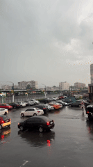 Rainy afternoon documented in Kharkiv parking lot