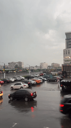 Rainy afternoon documented in Kharkiv parking lot