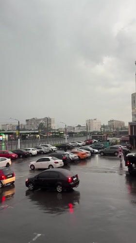 Rainy afternoon documented in Kharkiv parking lot