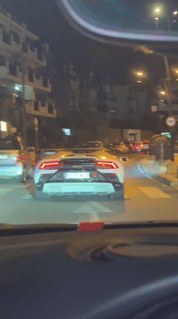 Stuck in Ibiza night traffic behind a white Lamborghini