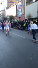 Costumed parade with flags observed in La Paz streets
