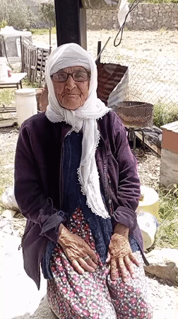 Elderly woman and woodcarver observed in morning Caracas scene