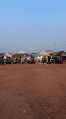 Full moon observed over Kurunduma Nigeria market at twilight
