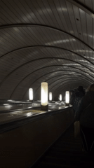 Early morning commuters use illuminated Moscow subway escalator