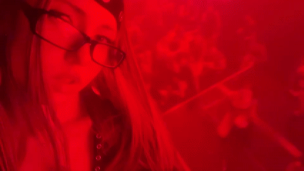 Milan club night: red lights, DJ set, and aerial performance