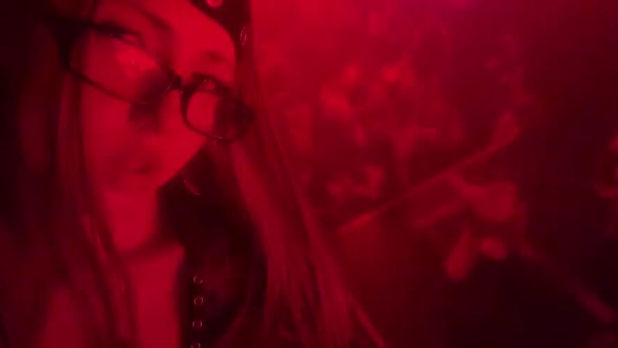 Milan club night: red lights, DJ set, and aerial performance