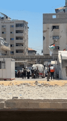 PRCS ambulance and damaged urban scenes in Gaza