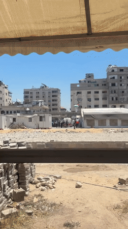 PRCS ambulance and damaged urban scenes in Gaza