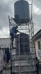 Water tank maintenance and hose storage activities in Ado